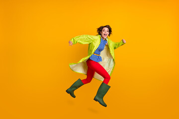 Fototapeta na wymiar Full length photo portrait of excited girl with open mouth running jumping up isolated on bright yellow colored background