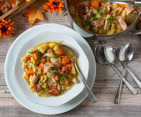 A plate of fresh cooked vegetable soup with meat