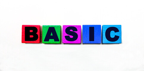 The word BASIC is written on colorful cubes on a light background