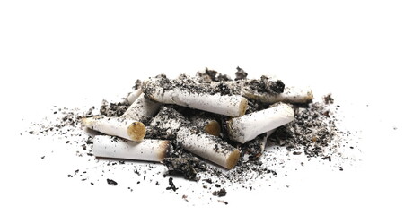 Cigarette stubs in ash pile isolated on white background