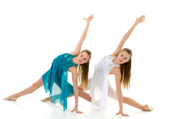 Obraz na płótnie Canvas Pretty Girls Gymnasts Performing Rhythmic Gymnastics Exercise.