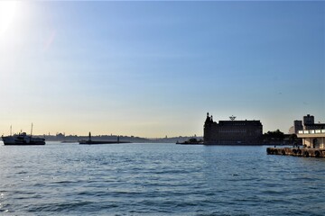 Obraz premium Istanbul during the sunset and colorful sky. Marmara sea and ferry during the sunset and ancient mosques silhouette and topkapi palace background and also Haydarpasha main train station.