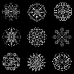 Set of snowflakes for Christmas and New Year festive decor. Winter shapes of precipitation. Fragile crystals and black background are isolated on different layers. Vector illustration