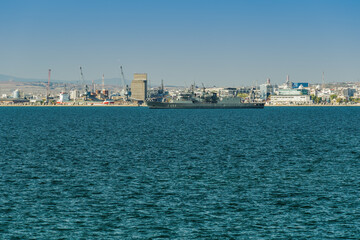 Fototapeta premium Greek frigate Hydra warship at sea. Hydra-class flagship of the Hellenic Navy moored outside the city port, during a national holiday in Thessaloniki, Greece.
