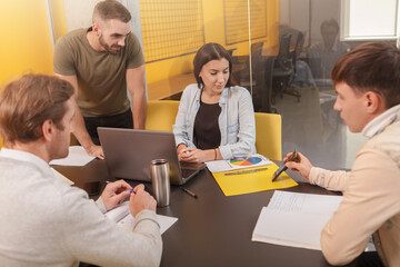 Obraz premium Group of creative designers discussing business during a meeting at boardroom