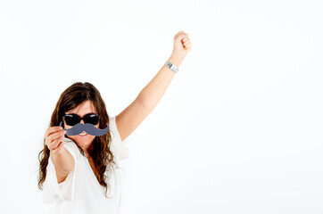 woman on white background celebrating movember. woman holds a joke mustache in fight against...