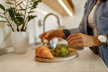 Spending time in kitchen, making snack.