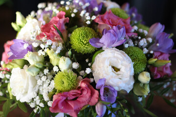 View from the top on a beautiful bouquet of flowers. Work of the florist at a flower shop. Delivery fresh cut flower. Floral shop. Happy birthday. Mather day. Valentine day. 8 March. Gift card