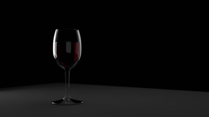 A glass of red wine on black minimalistic background.