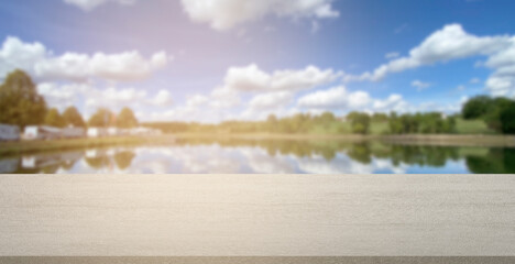 empty stone product display background RV park Mobilehome blur blue sky with clouds and lake. can...
