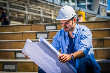 Fototapeta premium Engineer man works at industrial.engineers working on a building site .success business.