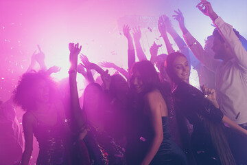 Photo of big group many fancy ladies dance have fun raise arms neon shiny spotlight modern club...