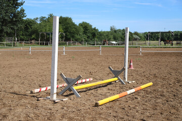 Fototapeta na wymiar Colorful photo of equestrian obstacles. Empty field for horse training event