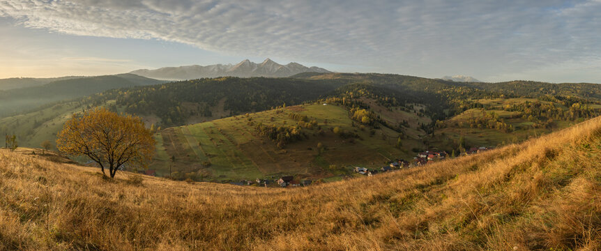 Iconic autumn colourful landscape photo of the village under the mountains. Travelling concept background. Super image of morning landscape.