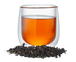 Glass cup of tea with dry tea leaves isolated on white