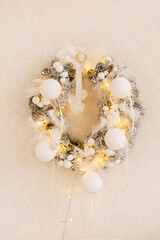 Christmas fir-tree wreath with lights on white background. Vintage New Year decorations. Spruce wreath. Christmas mood. Celebrating of New Year