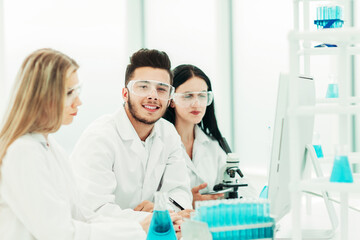 Fototapeta premium close up.a team of scientists use a computer to check the data