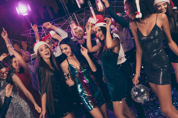 Photo of positive attractive people pretty ladies hold glass champagne glitter ball having fun modern club indoors