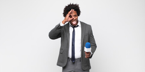 young black man as a tv presenter