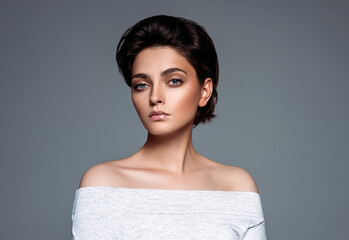 Portrait of a young brunette woman with stylish short hair