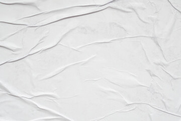 Blank white crumpled and creased paper poster texture background