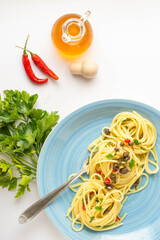linguine made with garlic, oregano, capers, olives, lemon peel, mackerel and a drop of aromatic oil...