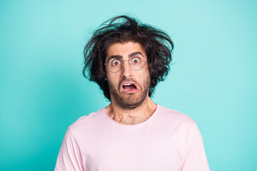 Close up portrait of speechless stressed guy wear spectacles pastel pink t-shirt isolated on teal color background