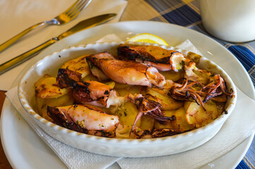 Roasted calamari with potatoes and lemon