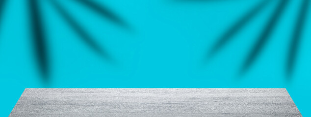 product display Summer and nature with stone stony table counter on blur coconut leaf horizontal banner background in blue color space. for text