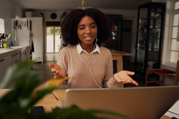 Successful african teacher on video call with students while teaching them online during...