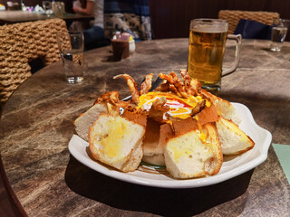 Baked Bread Stuffed with Curry & Soft Crab & beer in Thai RESTAURANT
