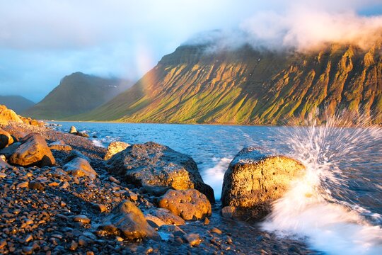 sunset in the mountains by sea