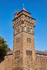 The clock tower of Cardiff Castle Wales UK completed in 1873 which is part of the wall of the 12th century Norman fort which is a popular tourism travel destination attraction landmark of the city