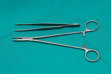 Needle holder and tweezers, medical instruments for smaller and larger surgical interventions