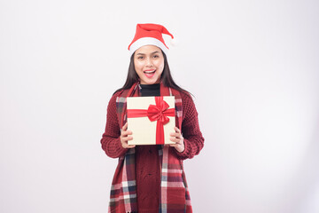 Portrait of young smiling woman wearing red Santa Claus hat isolated white background studio.