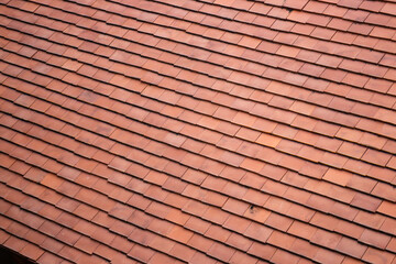 Red roof tiles in summer