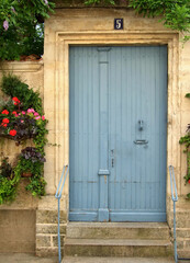 Fototapeta na wymiar Wooden door in a traditional facade - Portugal