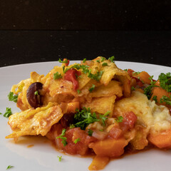 Mexican tacos from the oven with beans and cheddar cheese