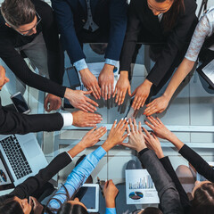 top view. business team joining their hands in a circle