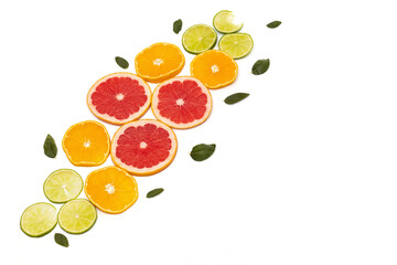 Slicing citrus fruits on a white background, copy space.