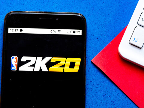In this photo illustration a NBA 2K20. appliance by 2K. logo is seen displayed on a smartphone
