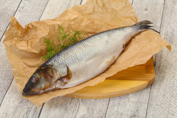 Salted herring over the wooden board
