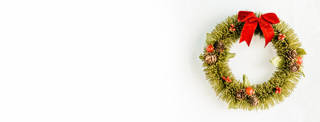 Christmas background.Winter wreath of pine needles decoration red and golden Christmas.Decoration celebration in holiday.Winter season.Round frame for Christmas cards and winter design layout.flat lay