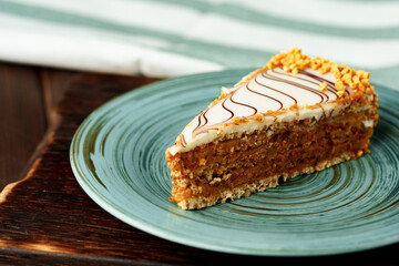 Piece of esterhazi cake on green plate