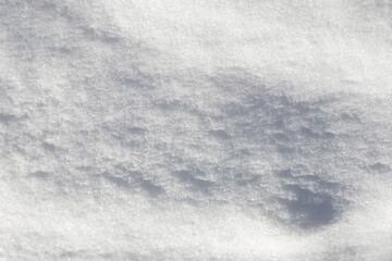 Abstract snowy background. Snow texture, selective focus