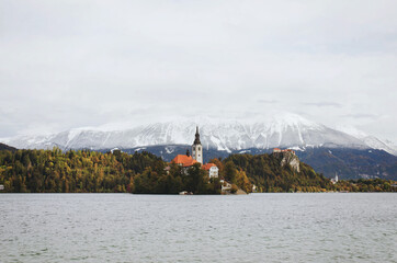 View of the snow-capped Alps mountain peaks against the backdrop of lake Bled.