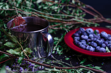 blueberries in a plate on a black background