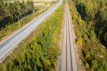 Railway through autumn forest. Aerial view