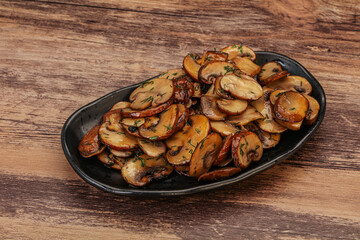 Roasted champignon with herbs and spices