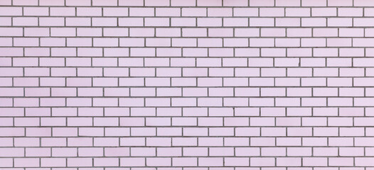 Wide light pink brick wall texture. New clean masonry. Panoramic view. Bricks background. Banner